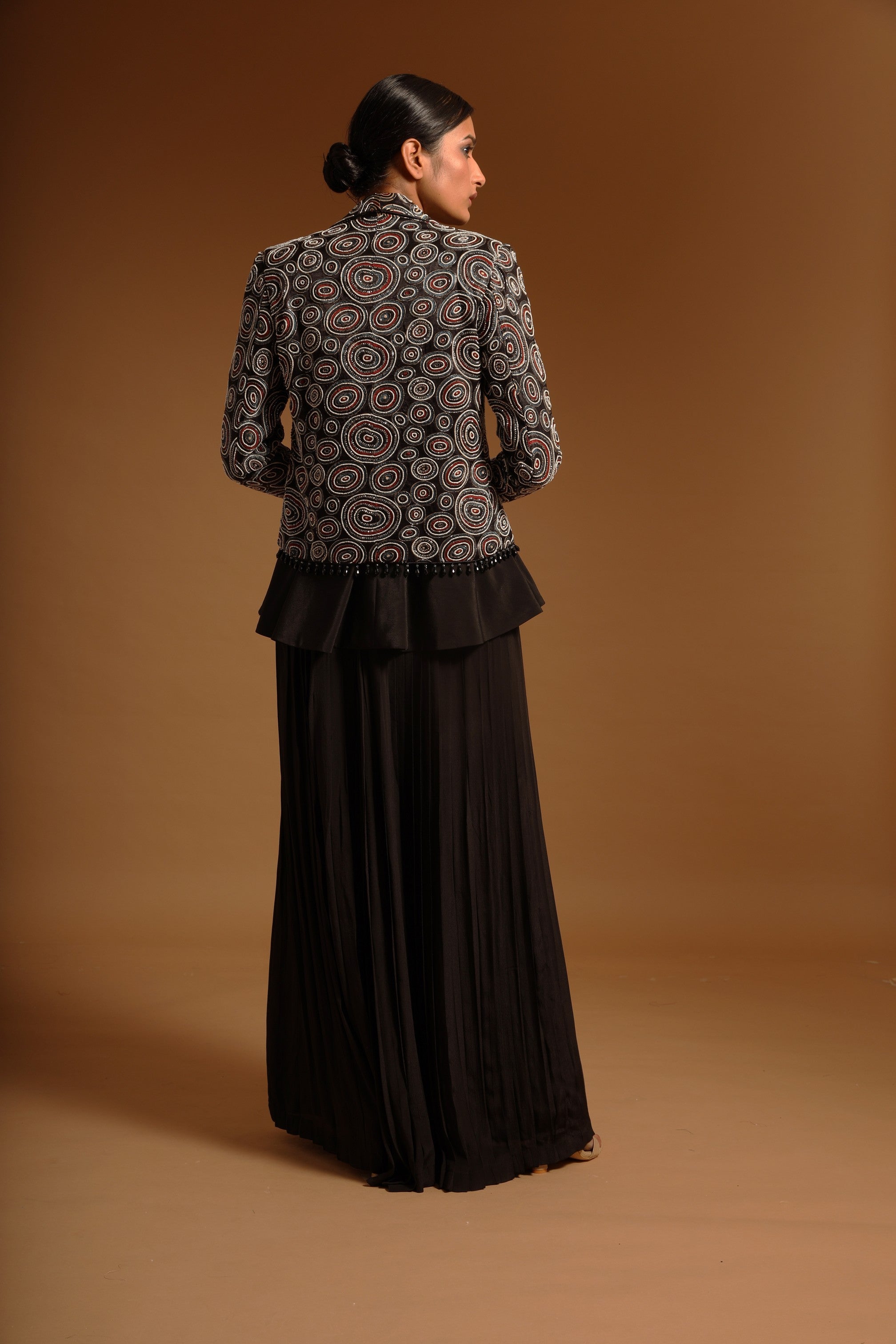 Black fully embroidered jacket with peplum top and pleated pants