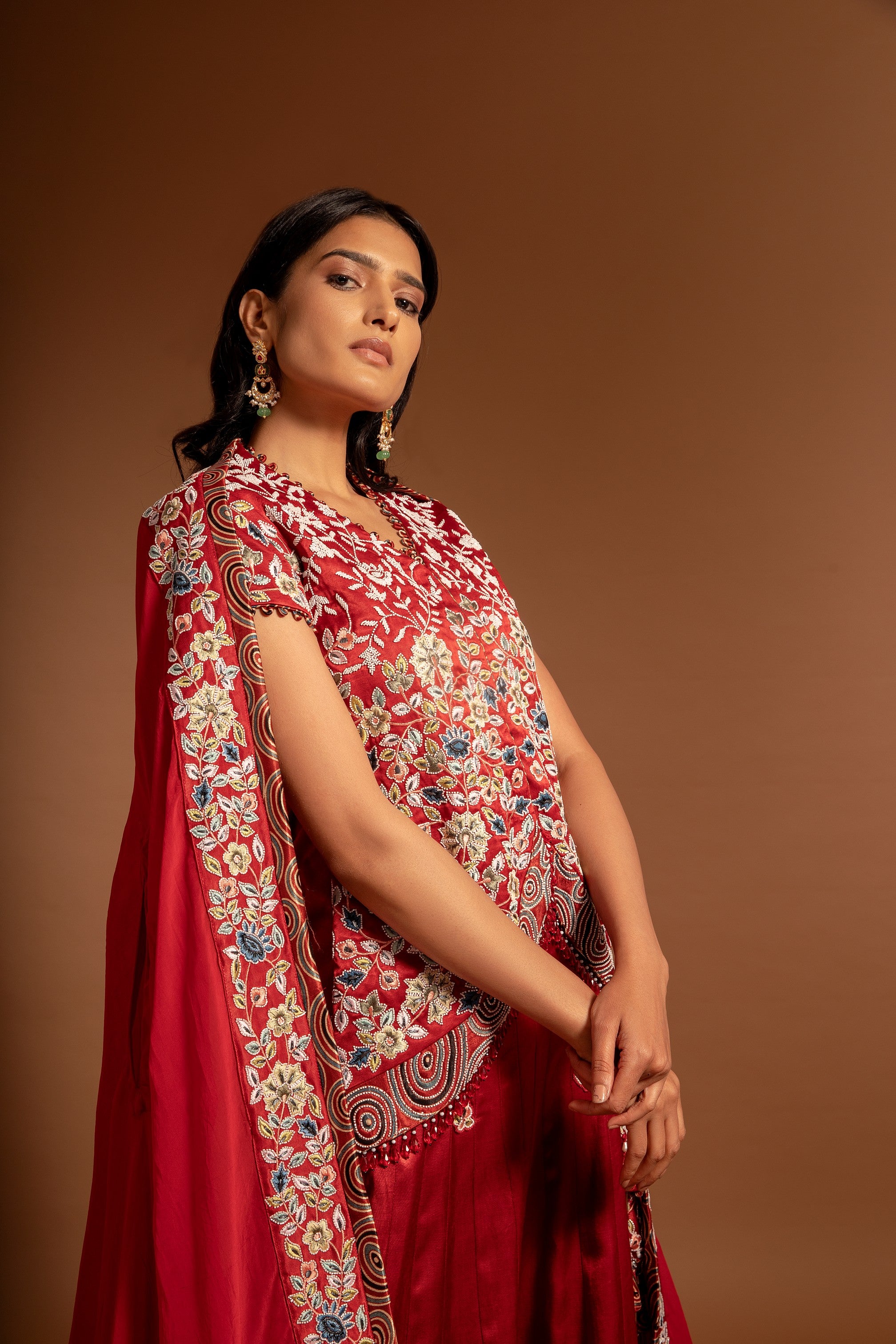 Red fully handcarfted jacket with lehenga and cape dupatta