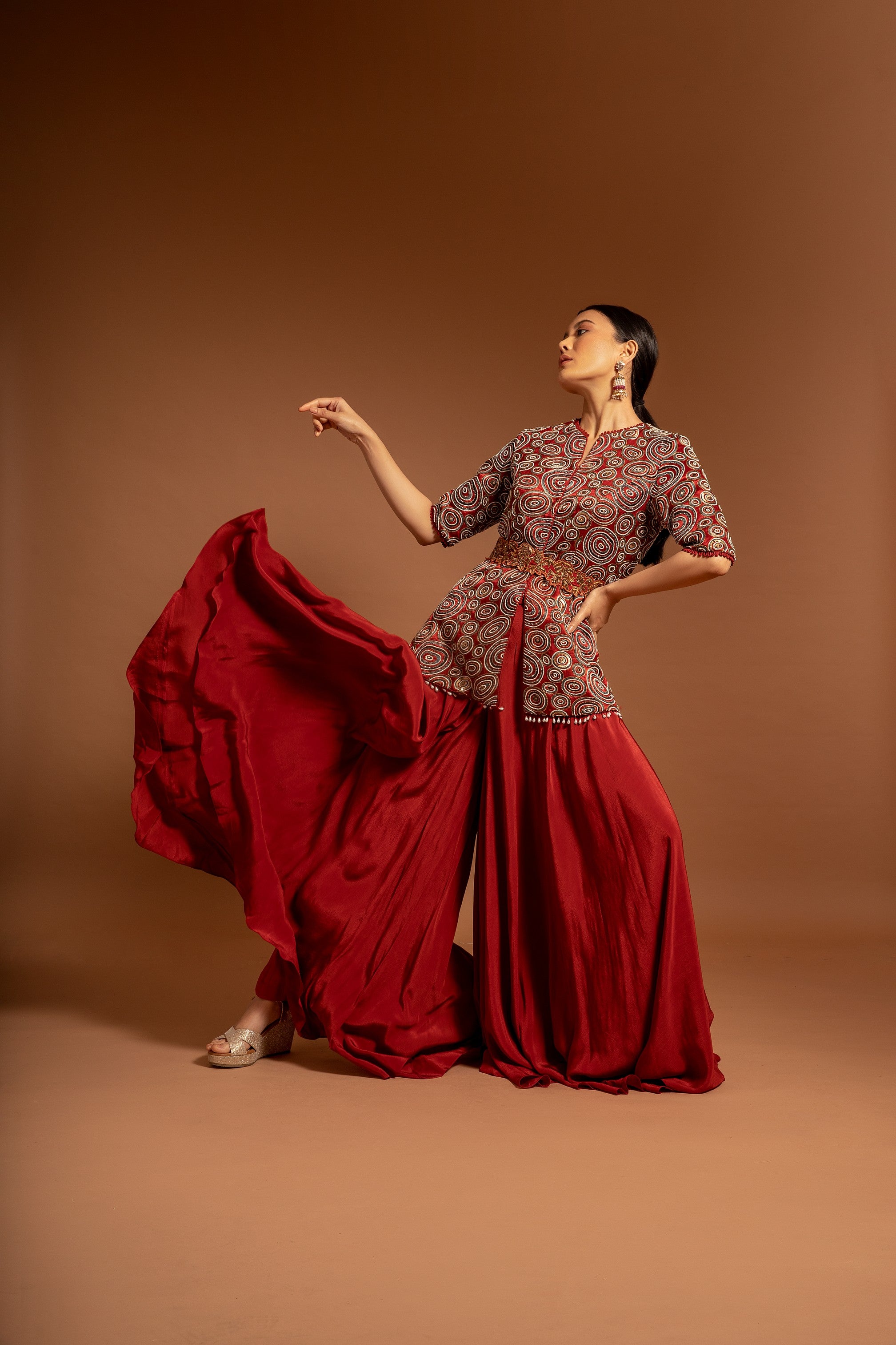 Red embroidered ajarkh peplum top with flare pants and embroidered waistbelt