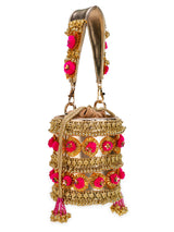 gold pompom handbag