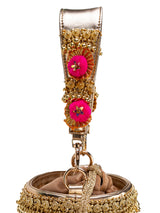gold pompom handbag