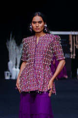 Purple fully embellished ajrakh peplum top with tiered sharara set