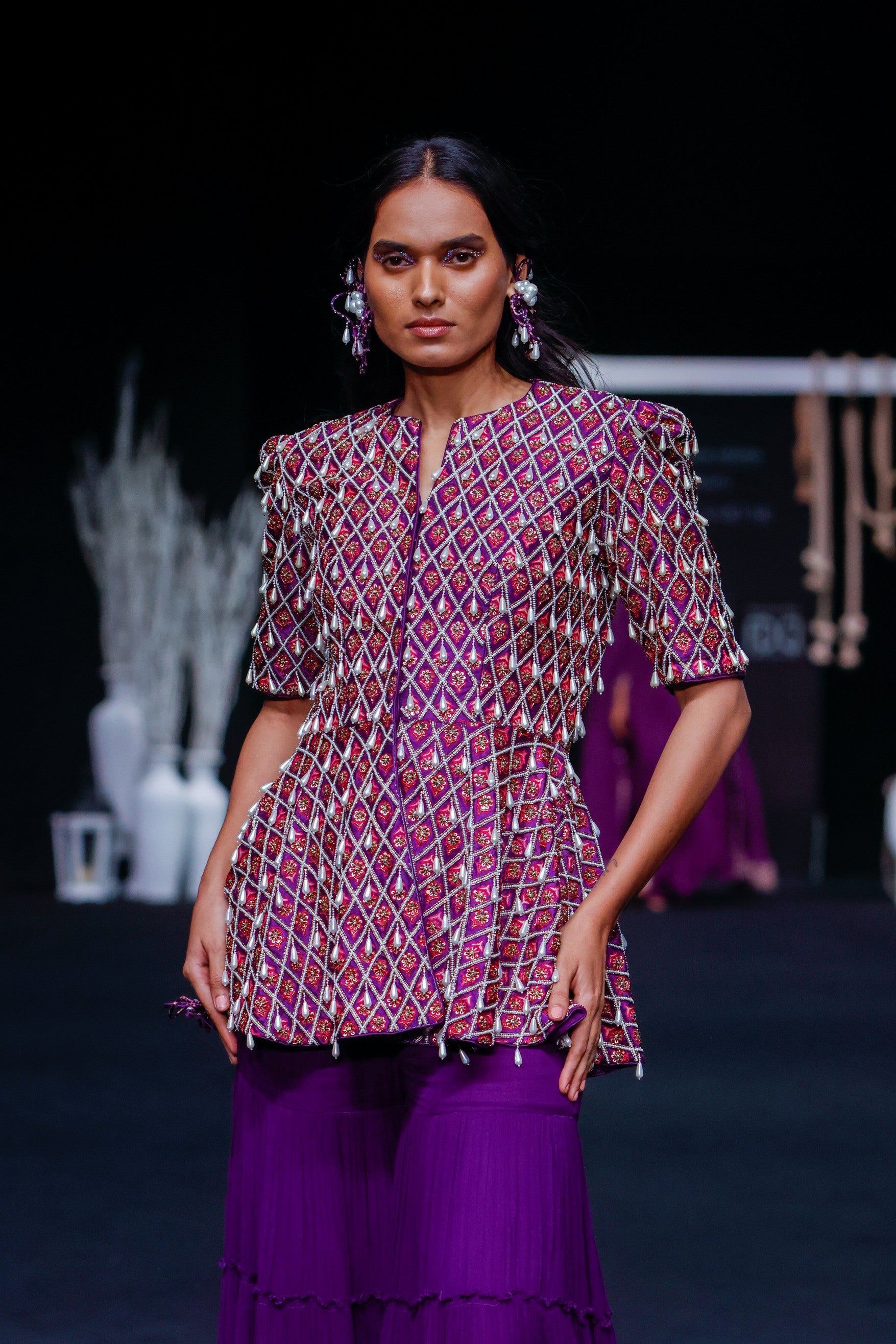 Purple fully embellished ajrakh peplum top with tiered sharara set