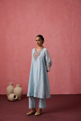 Sky blue chanderi dori work and french knot embroidered kurta paired with organic cotton slip, pant & organza dupatta