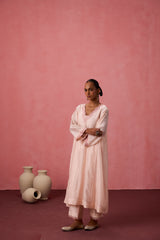 Cozy peach chanderi floral resham embroidered kurta paired with organic cotton slip, pant & organza dupatta