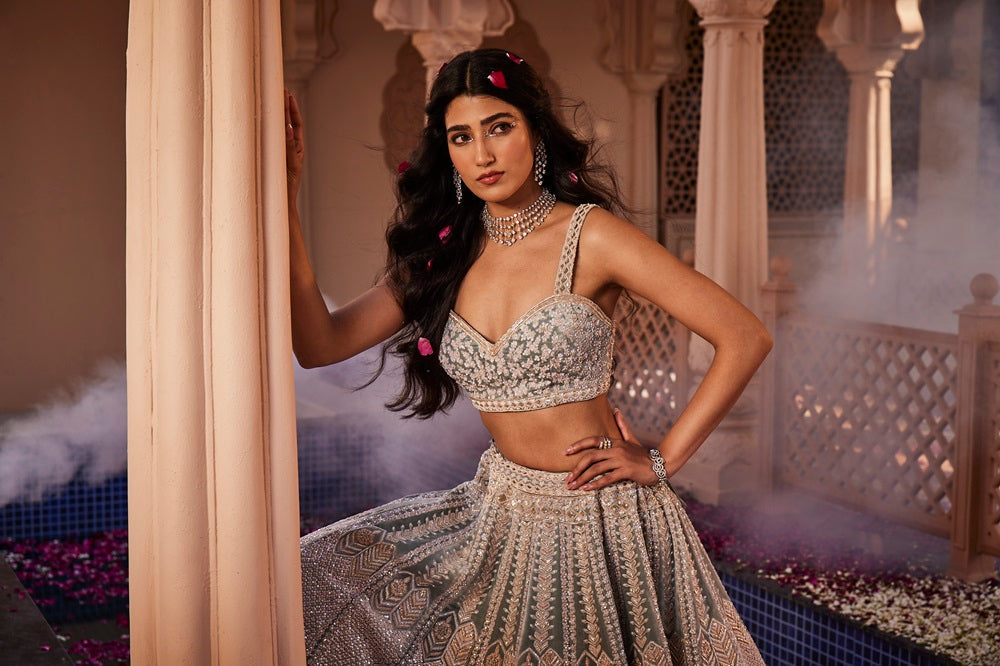 Dusty firoza velvet hand embroidered lehenga