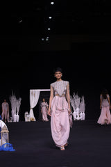 Peachy Pink ajrakh stripwork jacket paired up with Peachy pink bralette and drape dhoti skirt