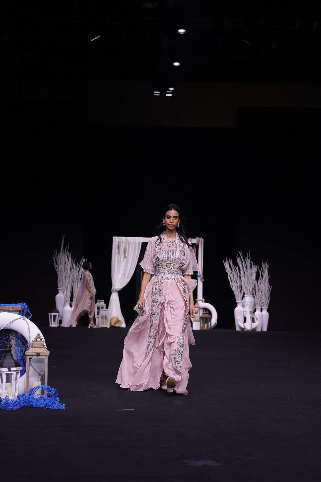 Peachy pink Ajrakh embroidered blouse paired up with Dhoti and ruffled dupatta