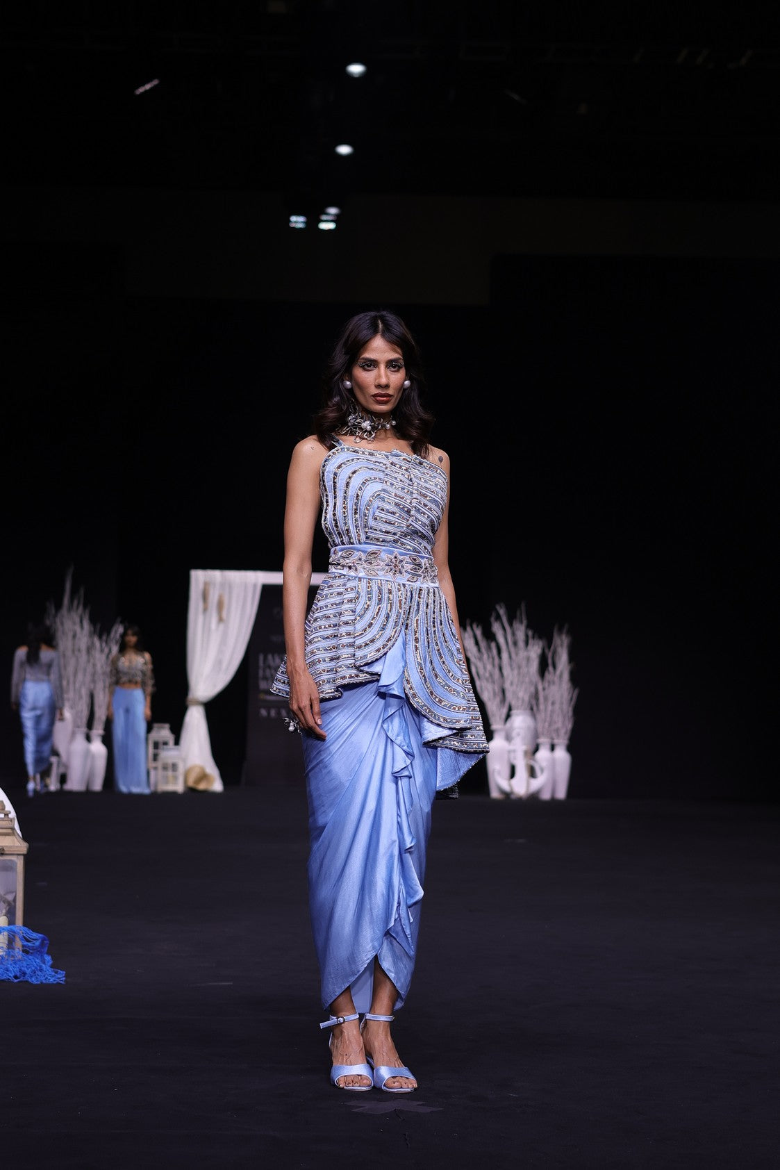 Powder blue ajrakh embroidered assymetric peplum top with Drape dhoti skirt