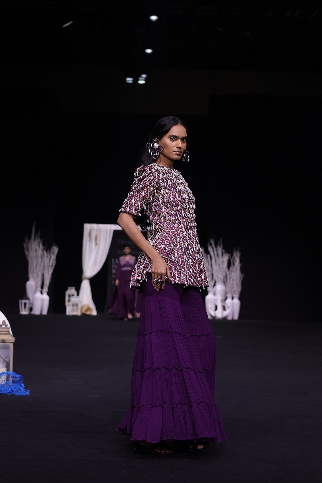 Purple fully embellished ajrakh peplum top with tiered sharara set
