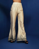 Ecru bell bottom pants