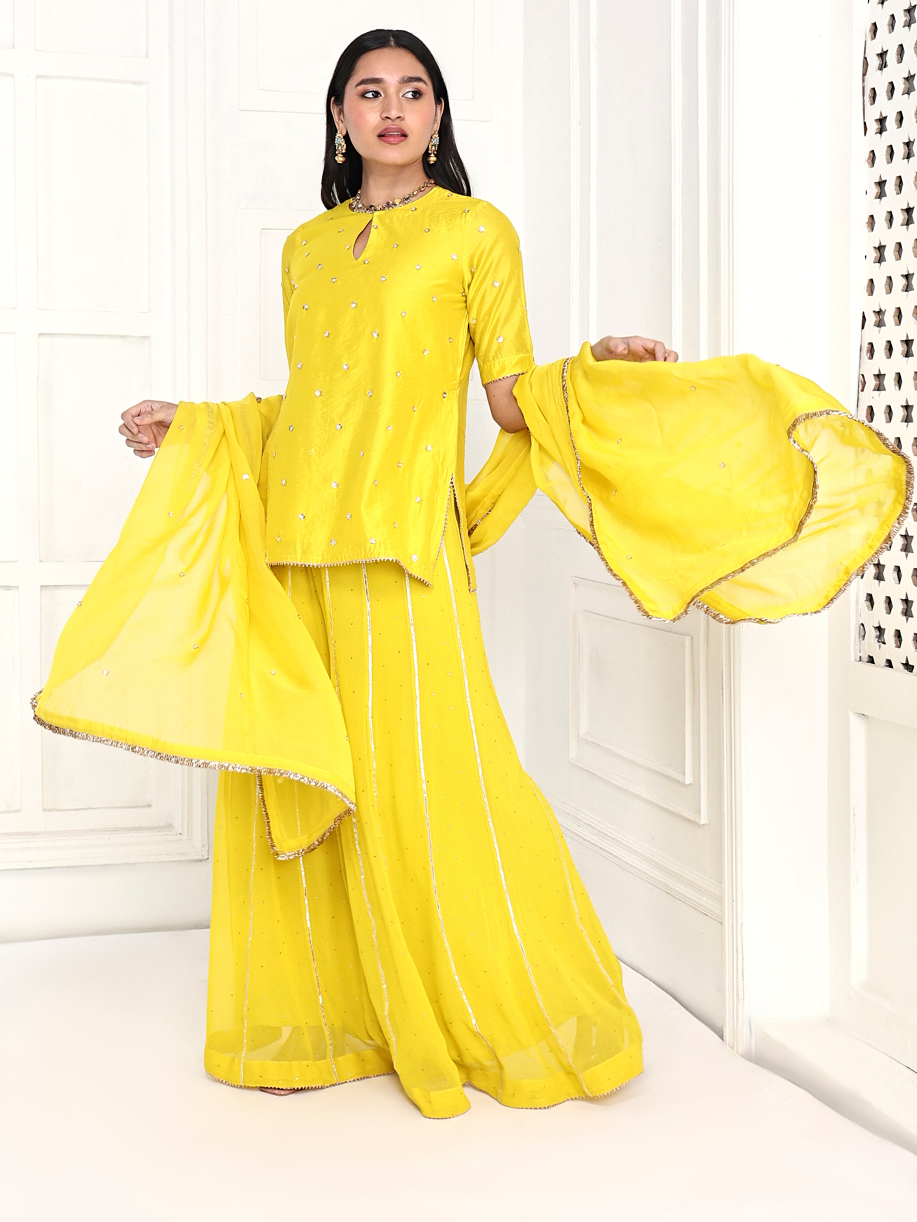 Short kurta paired with kali palazzo and dupatta