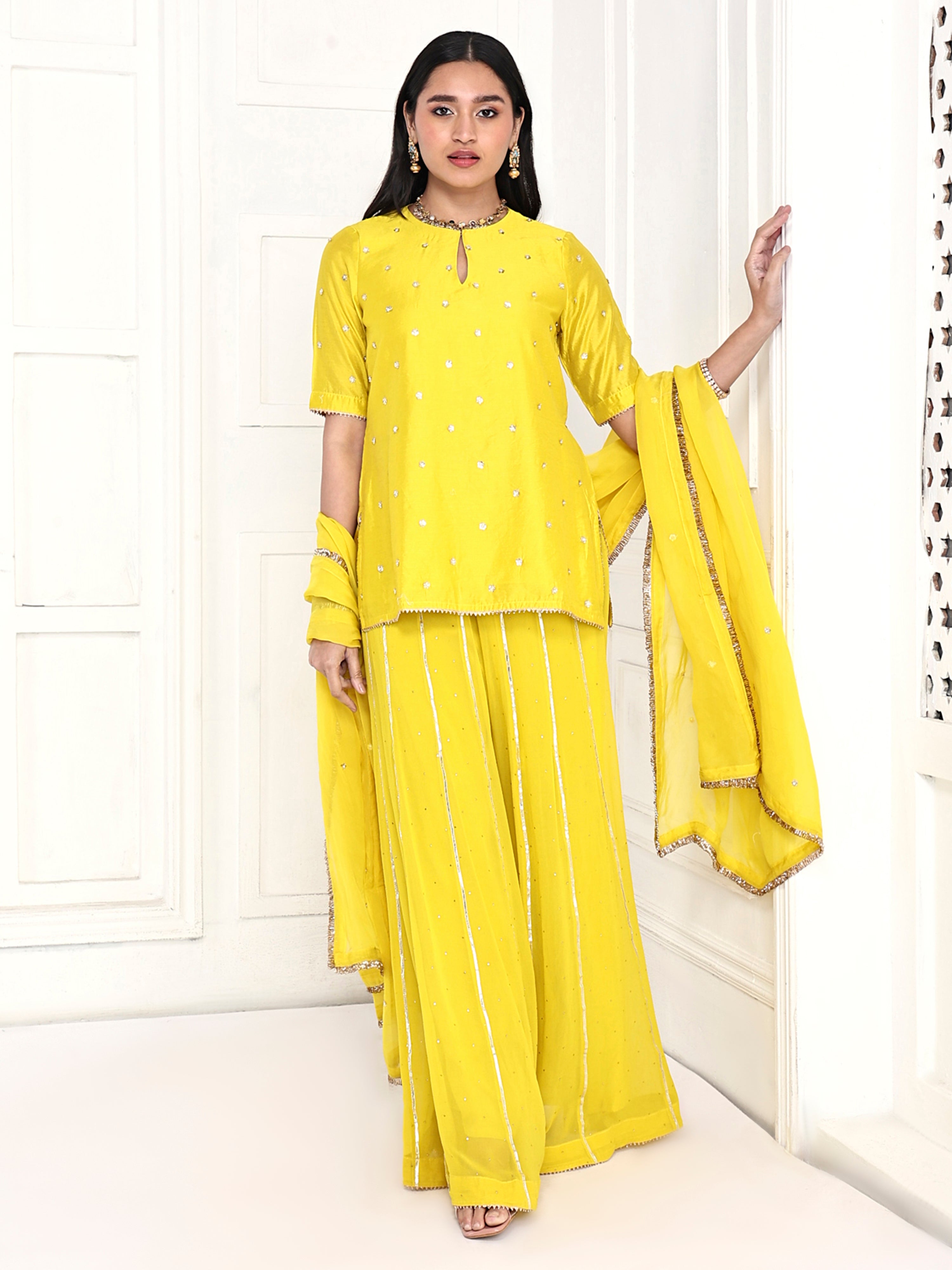 Short kurta paired with kali palazzo and dupatta