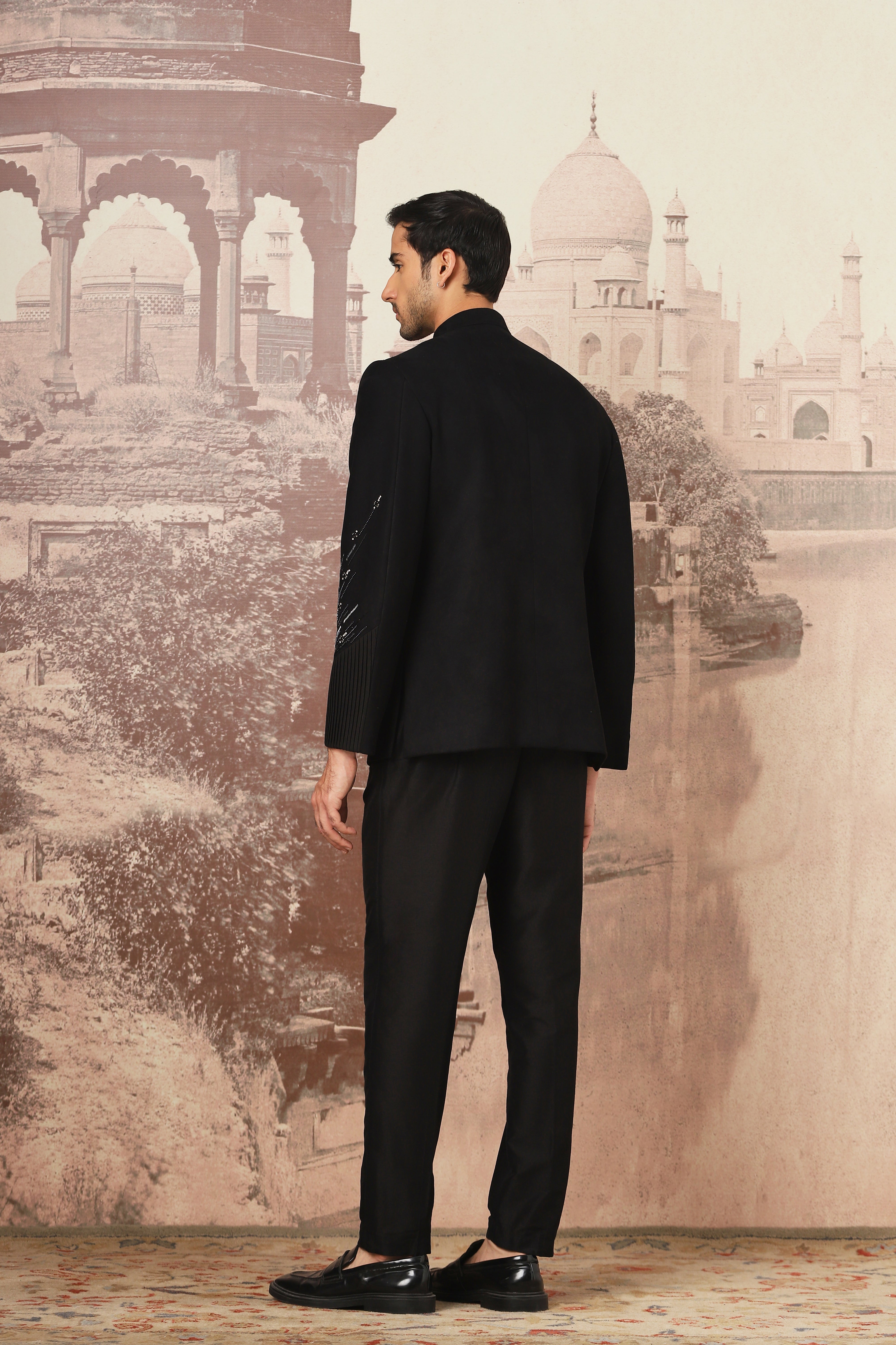 The Midnight Black Asymmetrical Hand Embroidered Bandhgala Set .