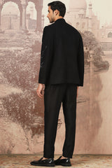 The Midnight Black Asymmetrical Hand Embroidered Bandhgala Set .