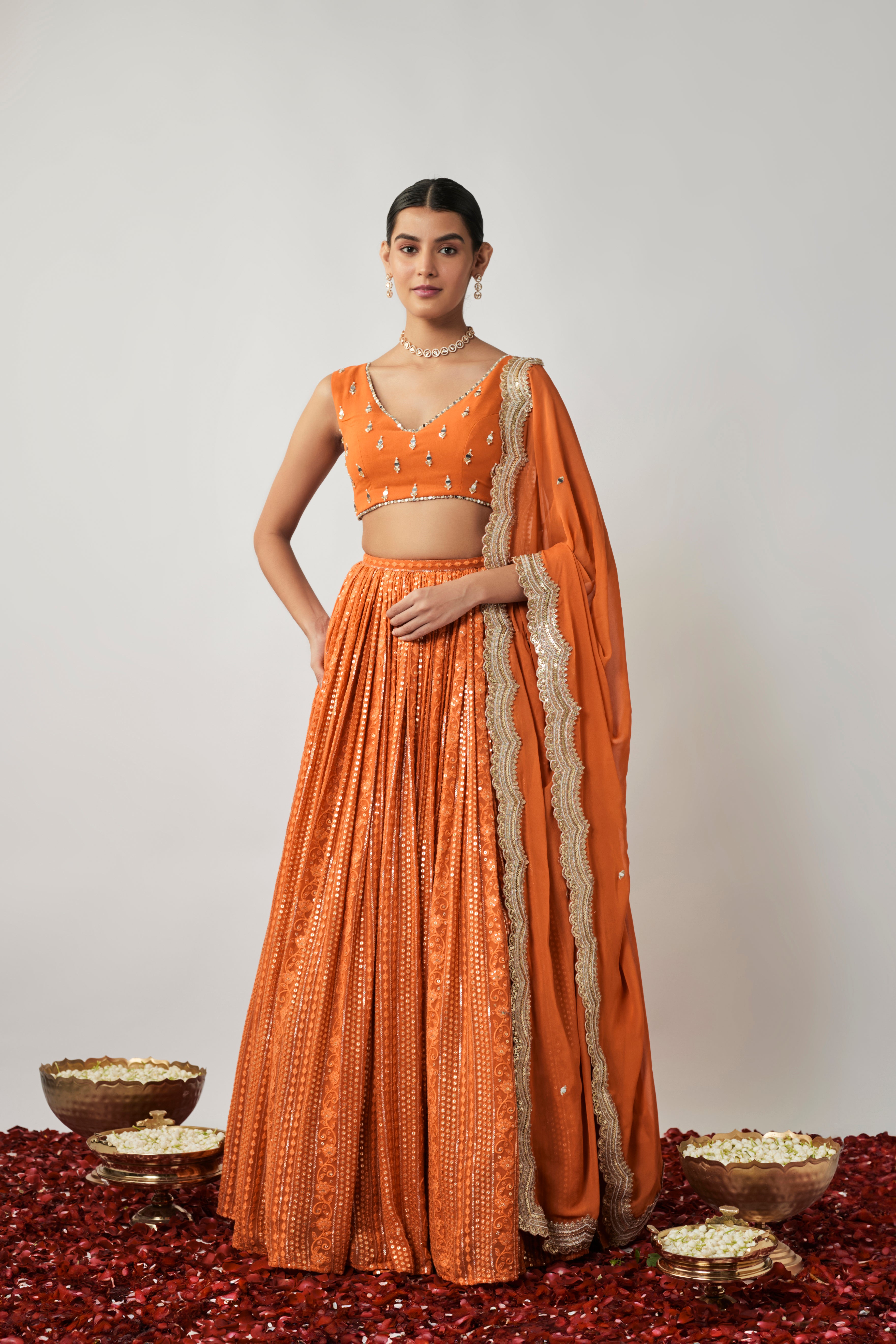 Saffron orange sequin and thread embroidered georgette lehenga set