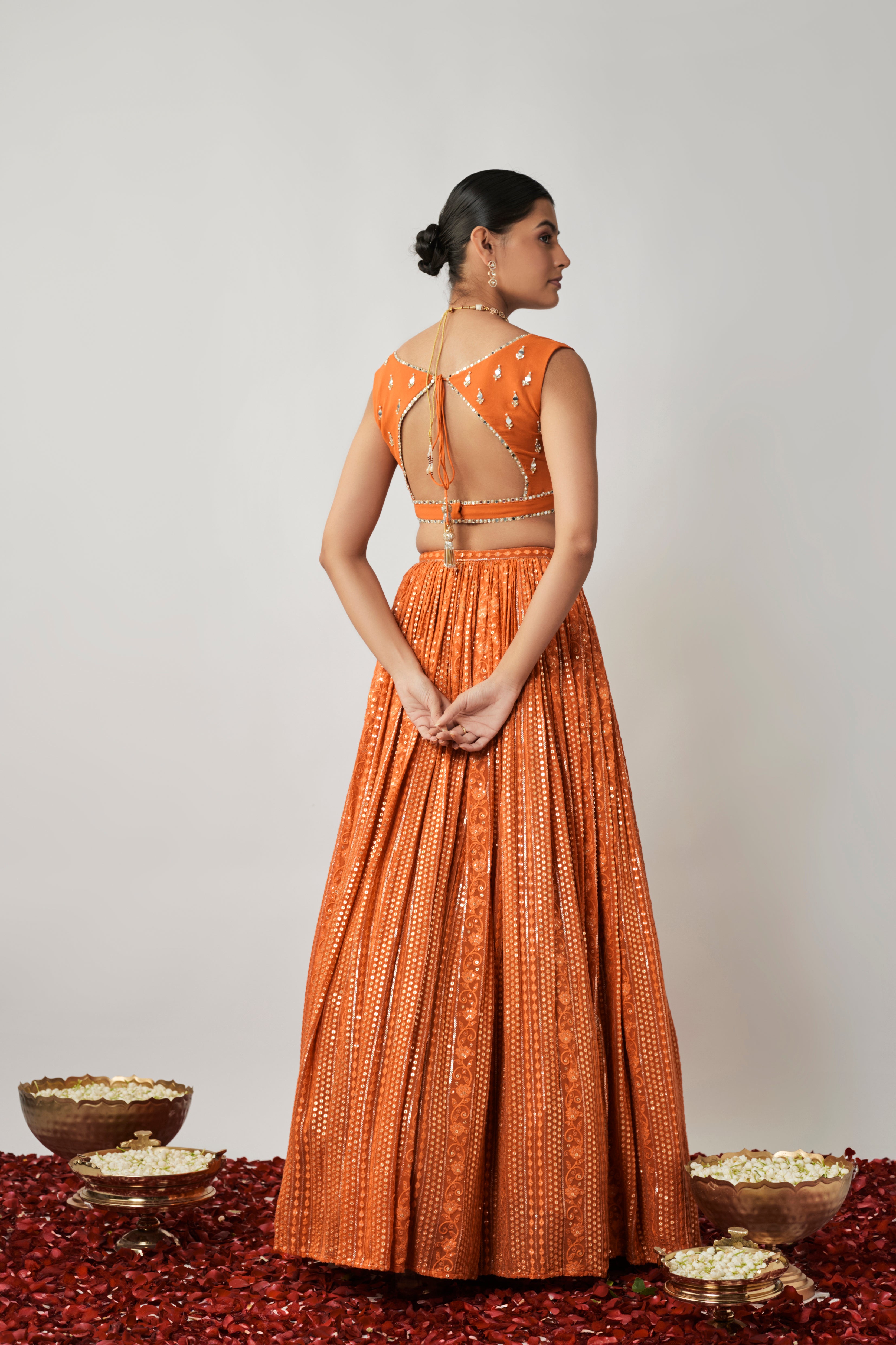 Saffron orange sequin and thread embroidered georgette lehenga set