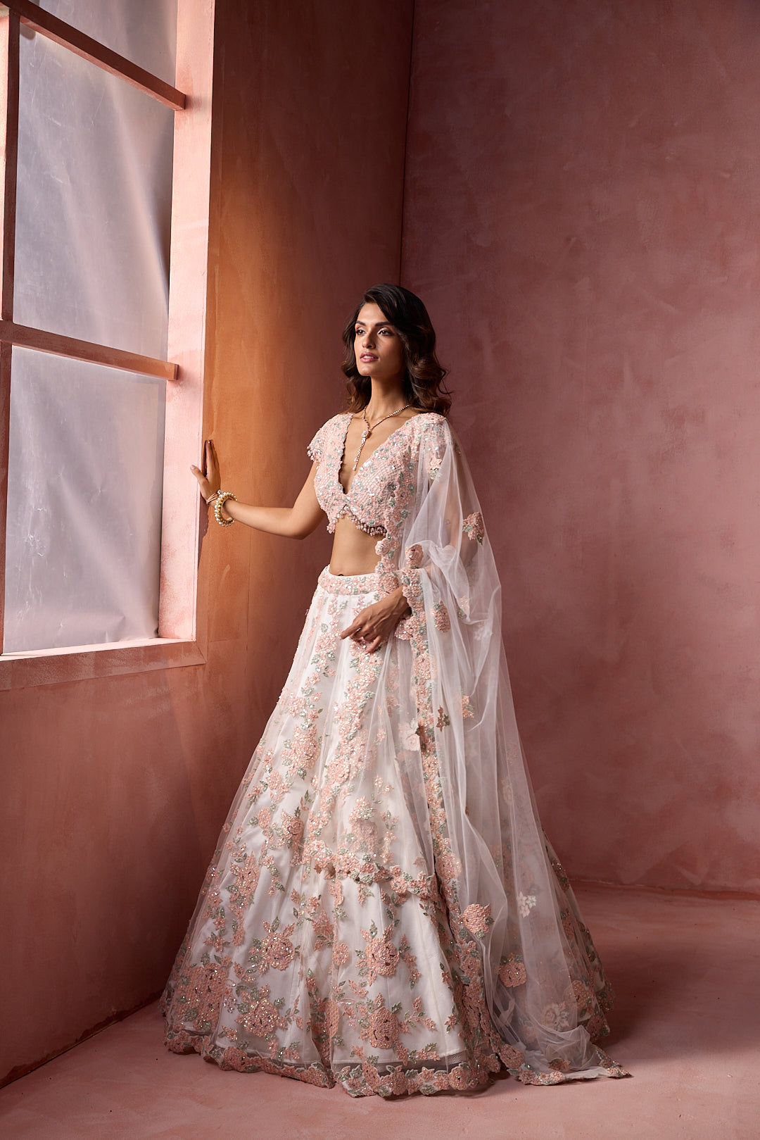 WHITE NET WITH LEATHER APPLIQUE LEHENGA SET