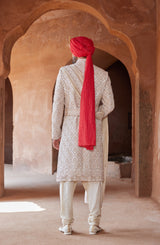 IVORY TAFETTA SHERWANI WITH MONGA SILK KURTA AND CHURIDAR