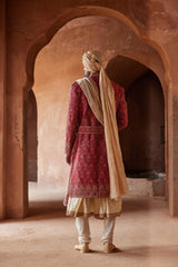 RED MATKA SILK EMBROIDERED SHERWANI WITH BEIGE MONGA TUSSAR KALIDAR KURTA AND CHURIDAR