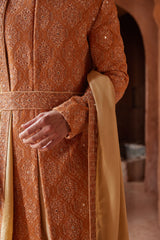 RUST MATKA SILK EMBROIDERED SHERWANI WITH BEIGE MONGA TUSSAAR KURTA CHURIDAR