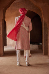 CORAL MATKA SILK SHERWANI ALL OVER EMBROIDERED WITH RESHAM AND BEADWORK WITH A BLUSH MONGA TUSSAR KURTA AND COTTON LYCRA TROUSERS