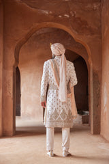 BLUSH PINK TAFETTA SILK EMBROIDERED SHERWANI WITH A MONGA TUSSAR KURTA AND COTTON LYCRA TROUSER