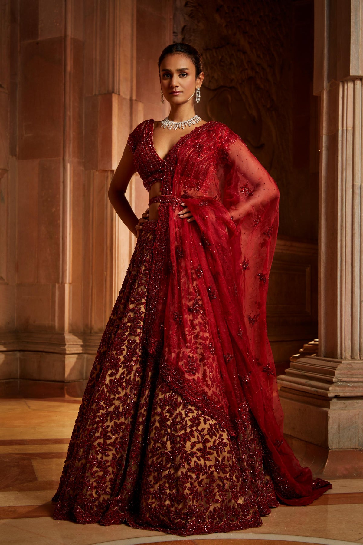 Nude Tulle Lehenga Choli with worked Belt and contrasting Organza Dupatta with an Optional Tulle Veil