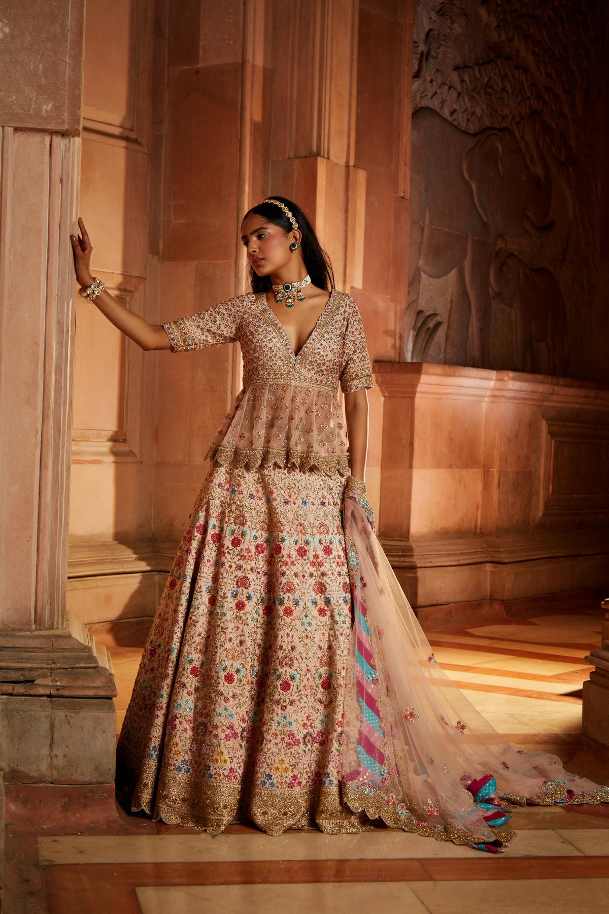 Blush Pink Raw Silk Lehenga with a Peplum Top and Tulle Dupatta