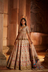 Blush Pink Raw Silk Lehenga with a Peplum Top and Tulle Dupatta