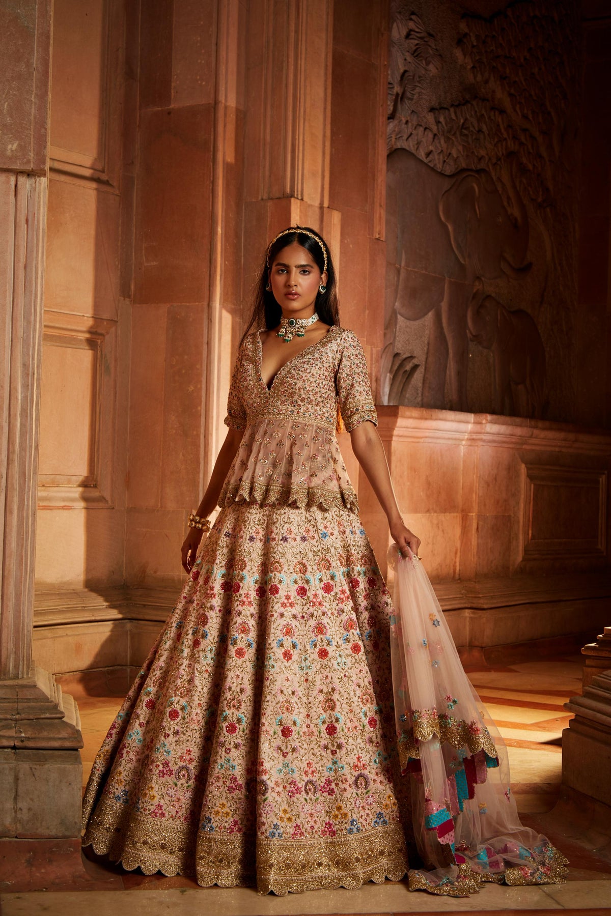 Blush Pink Raw Silk Lehenga with a Peplum Top and Tulle Dupatta
