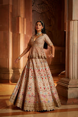 Blush Pink Raw Silk Lehenga with a Peplum Top and Tulle Dupatta