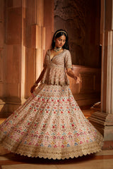 Blush Pink Raw Silk Lehenga with a Peplum Top and Tulle Dupatta
