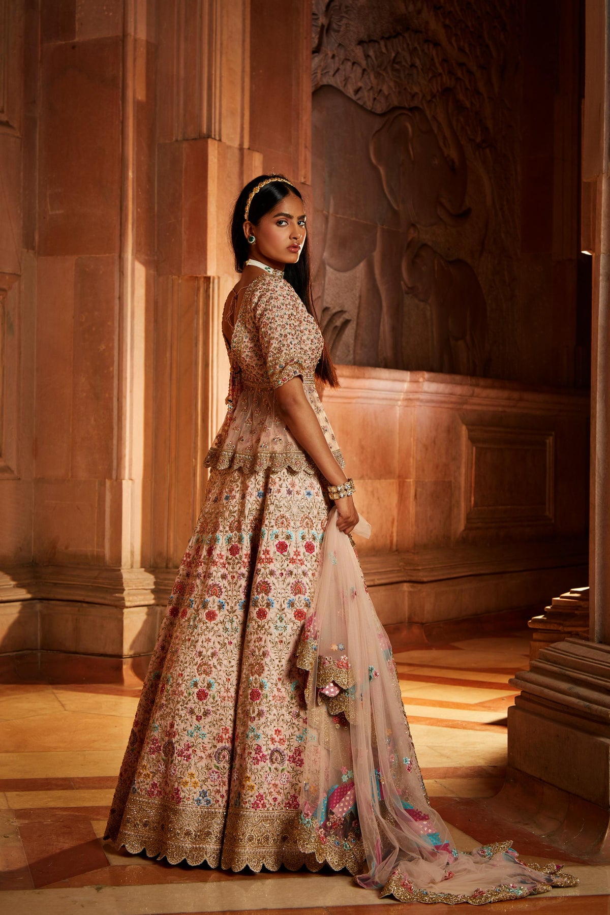 Blush Pink Raw Silk Lehenga with a Peplum Top and Tulle Dupatta