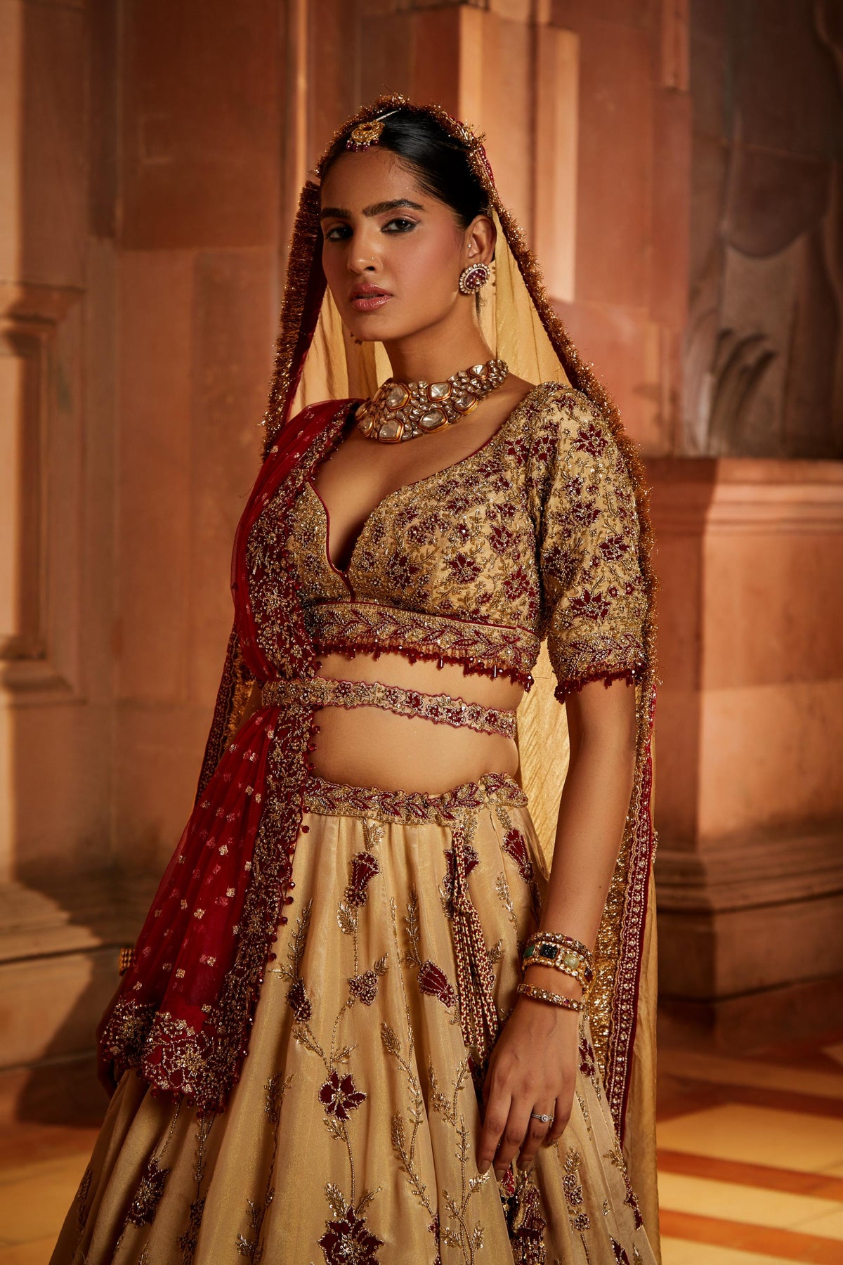 Gold Tissue Lehenga Choli and Belt with contrasting Red Tulle Dupatta and Optional Gold Tissue Second Dupatta