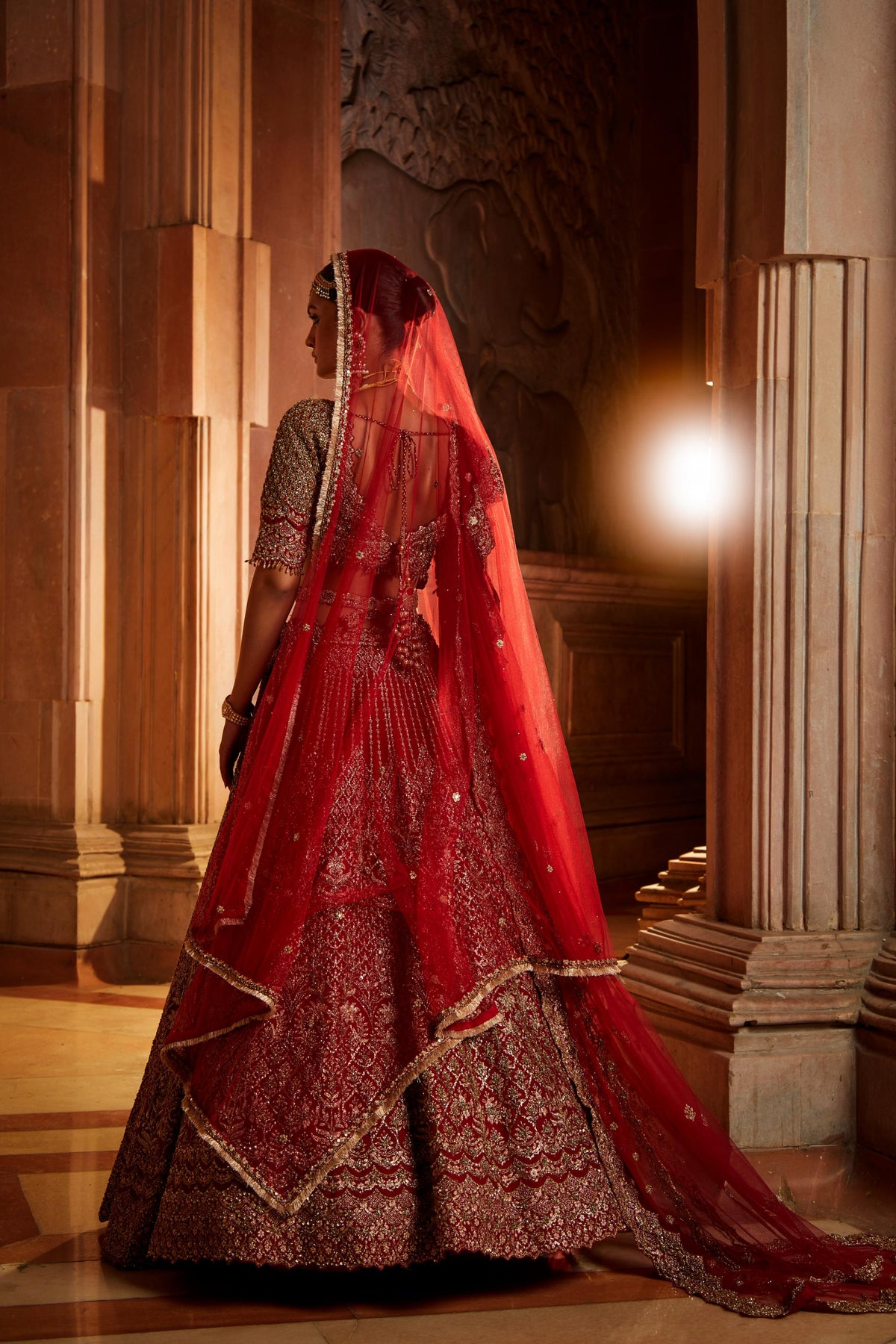 Jannat Khan In Blood Red Raw Silk Lehenga Choli and Belt with Tulle Dupatta with an Optional Lighter Second Dupatta