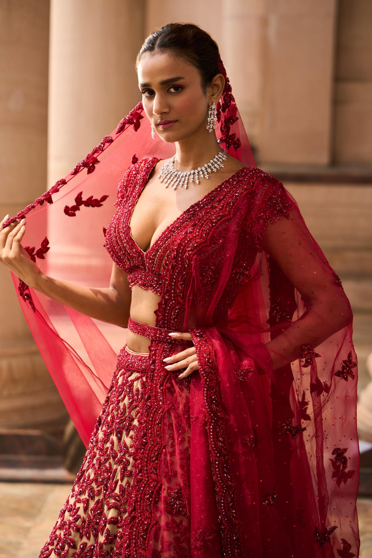 Nude Tulle Lehenga Choli with worked Belt and contrasting Organza Dupatta with an Optional Tulle Veil