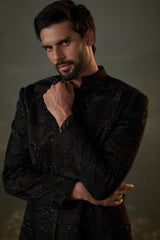 BLACK SHORT RAW SILK SHERWANI ALL OVER EMBROIDERED WITH KURTA AND TROUSER