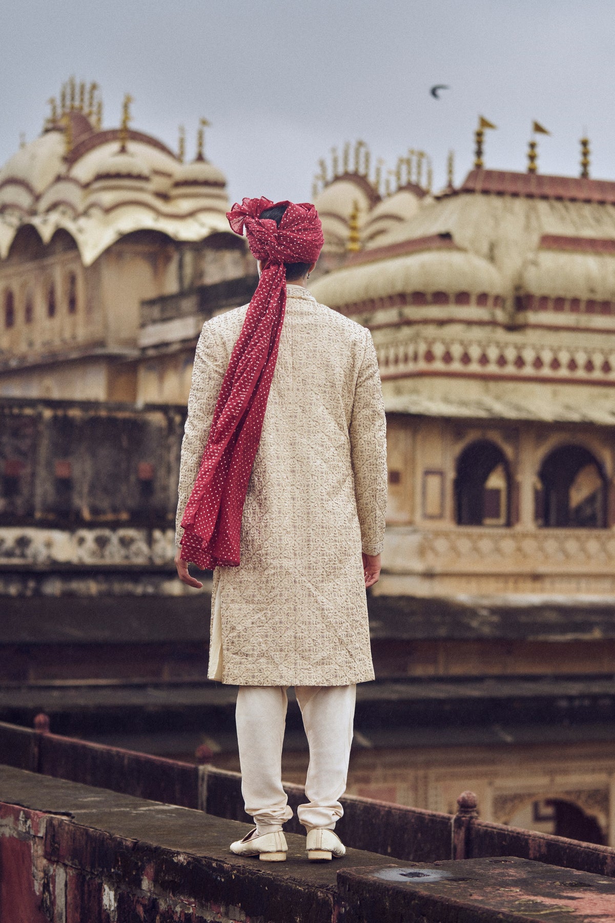 LIGHT BEIGE RAW SILK SHERWANI WITH KURTA AND CHURIDAR WITH OPTIONAL BELT, STOLE AND JUTIS