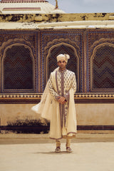 BEIGE RAW SILK SHERWANI WITH COTTON SILK CHOGA AND CHURIDAR WITH OPTIONAL STOLE AND JUTIS