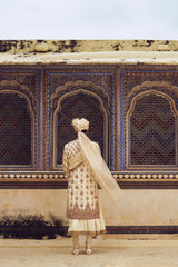BEIGE RAW SILK SHERWANI WITH COTTON SILK CHOGA AND CHURIDAR WITH OPTIONAL STOLE AND JUTIS