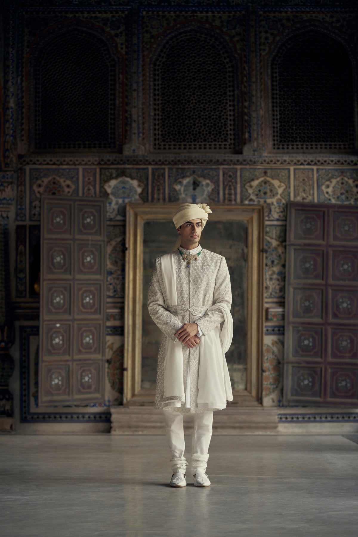 IVORY RAW SILK SHERWANI WITH KURTA AND CHURIDAR WITH OPTIONAL WORKED STOLE, BELT AND EMBROIDERED JUTIS