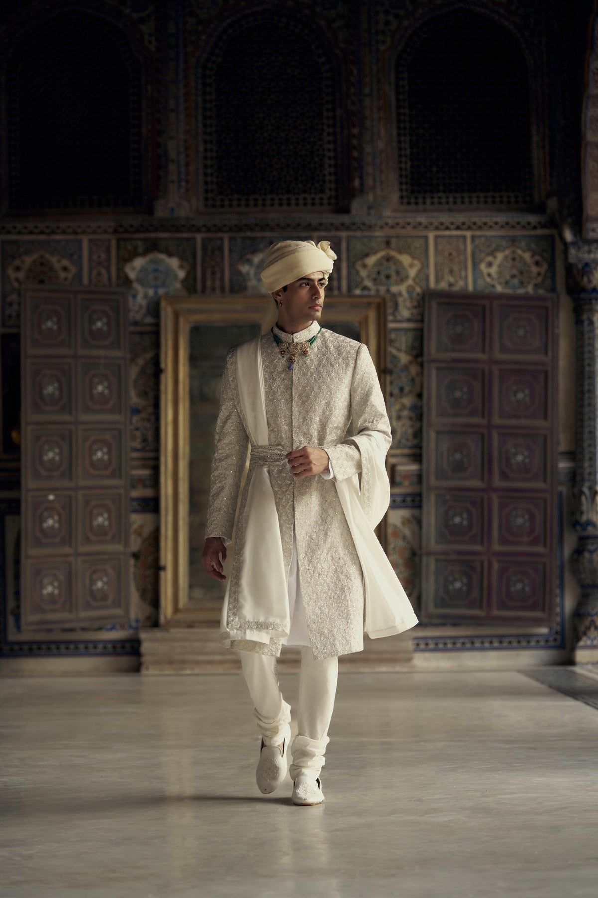 IVORY RAW SILK SHERWANI WITH KURTA AND CHURIDAR WITH OPTIONAL WORKED STOLE, BELT AND EMBROIDERED JUTIS