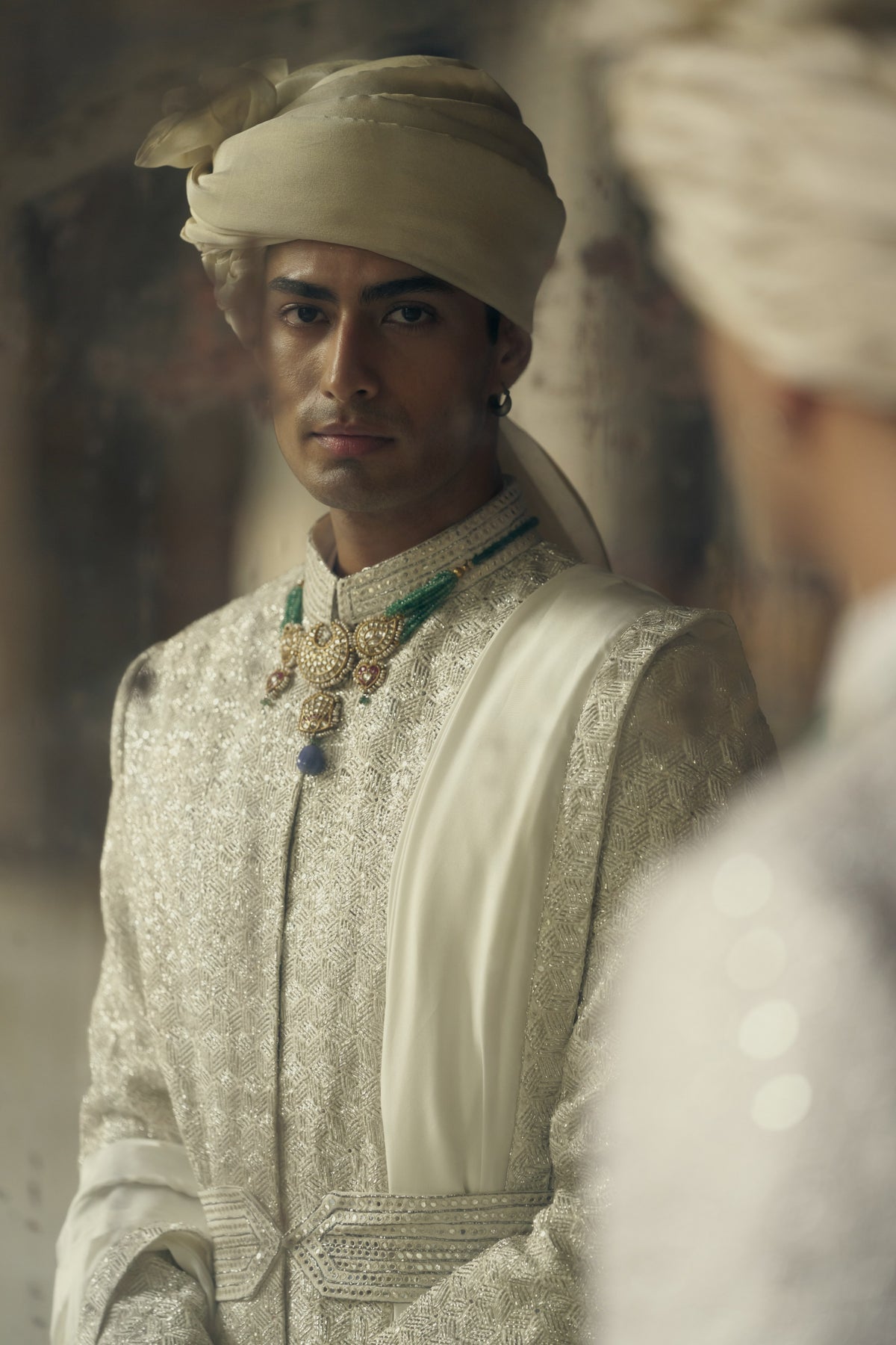 IVORY RAW SILK SHERWANI WITH KURTA AND CHURIDAR WITH OPTIONAL WORKED STOLE, BELT AND EMBROIDERED JUTIS