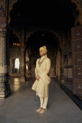 GOLD RAW SILK SHERWANI WITH KURTA AND CHURIDAR WITH OPTIONAL WORKED BELT, STOLE AND JUTIS