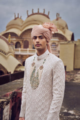 NUDE RAW SILK SHERWANI WITH KURTA CHURIDAR AND OPTIONAL WORKED STOLE, BELT AND JUTI