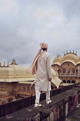 NUDE RAW SILK SHERWANI WITH KURTA CHURIDAR AND OPTIONAL WORKED STOLE, BELT AND JUTI
