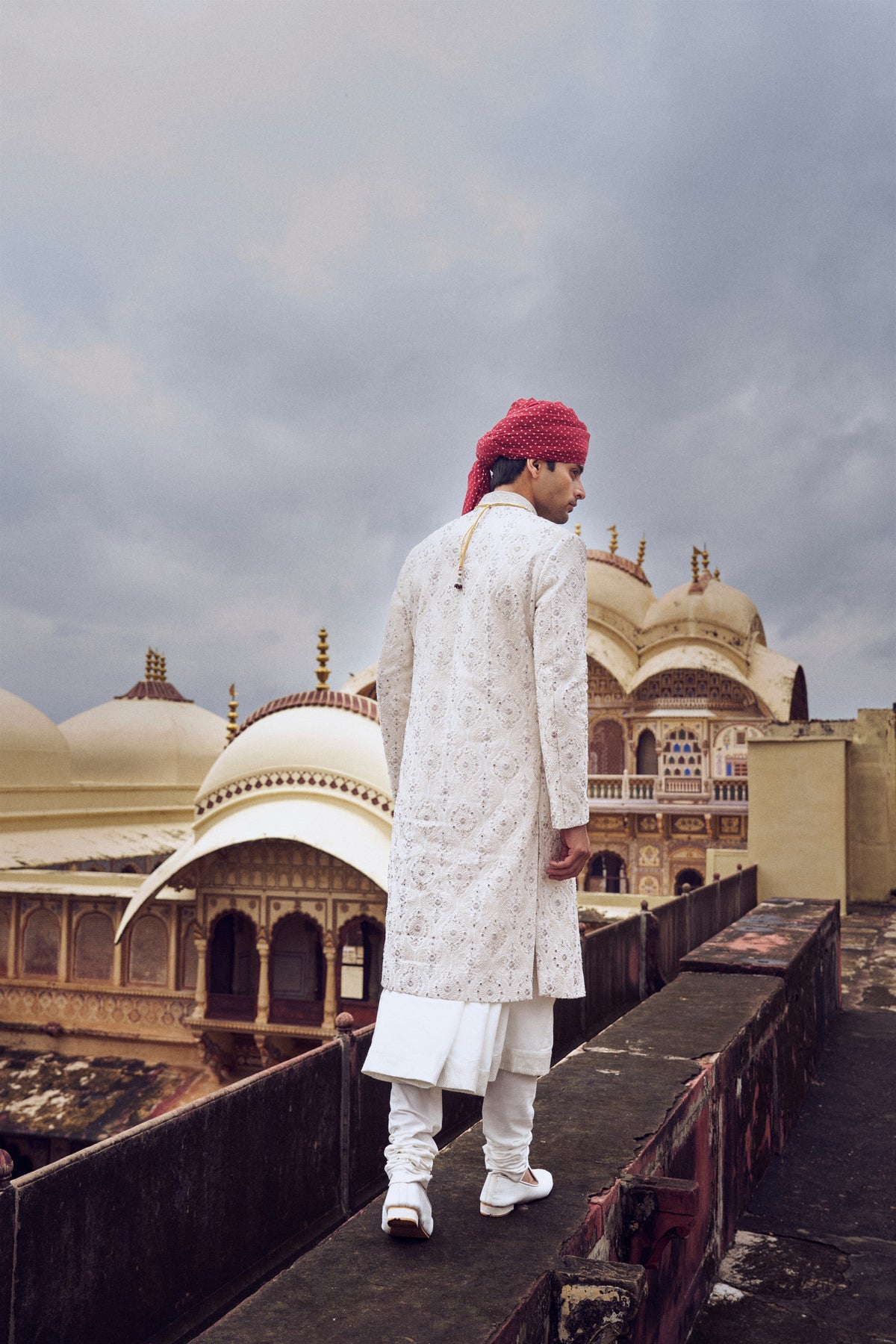 IVORY RAW SILK SHERWANI WITH COTTON SILK CHOGA AND CHURIDAR AND OPTIONAL STOLE, BELT AND WORKED JUTI