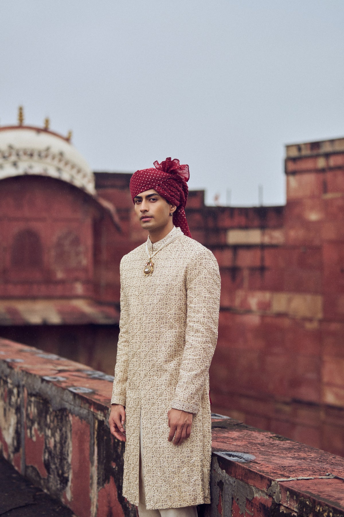 LIGHT BEIGE RAW SILK SHERWANI WITH KURTA AND CHURIDAR WITH OPTIONAL BELT, STOLE AND JUTIS