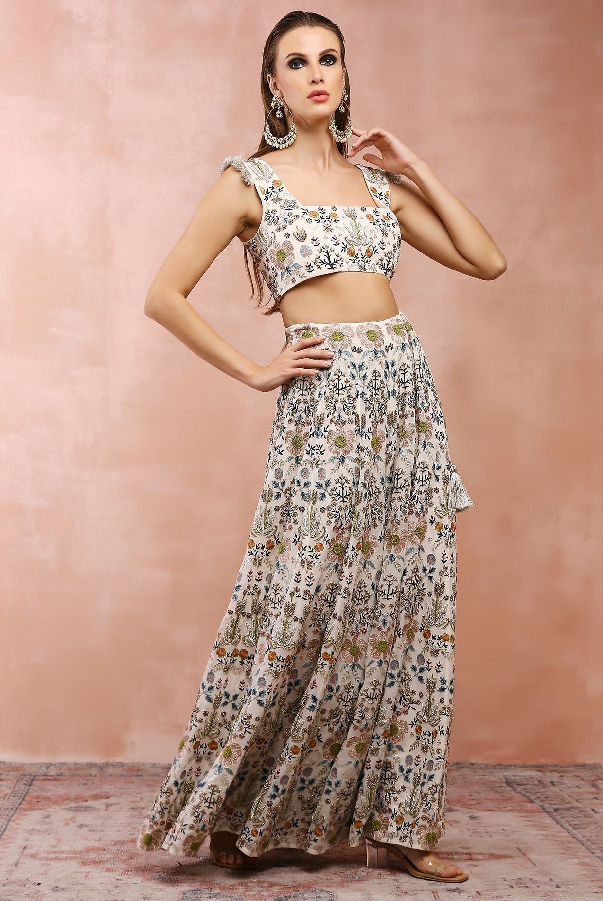 Off white embroidered choli with sharara.